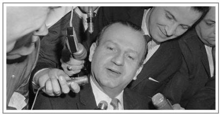 Original caption: Jack Ruby's defense lawyer, searching for evidence that the killer of Lee Harvey Oswald may not get a fair trial in Dallas, denied a report that Ruby visited Communist Cuba last year. Ruby seemed to be in a better mood as he talked to newsmen before the start of the second day of his court hearing, in order to get his trial to some other Texas city. February 11, 1964 Dallas, Texas, USa